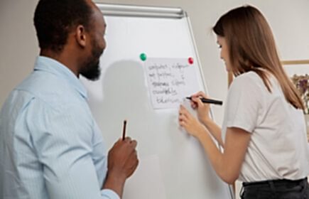 Lesson. Hindustani courses at home. Smiling man teaches students, explaining remotely in interior of living room. Using devices. Concept of remote education, quarantine, modern gadgets.